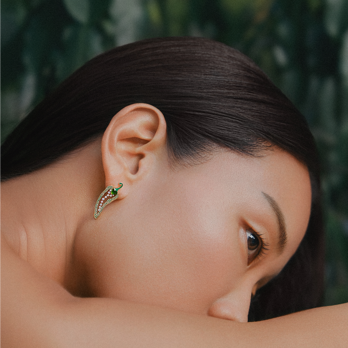 Model wearing Cocoerow Aya Earring in green emeralds 14k yellow gold