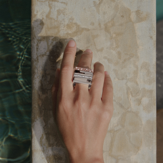 Nomi ring by cocoerow fine jewelry in silver with white diamonds on models hand