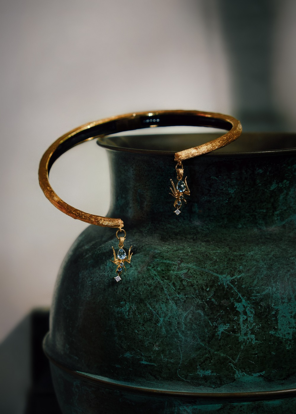 Aquamarine tree-choker necklace from Cocoerow's Kokoro collection featuring sculptural ant motifs, worn as a lifestyle styling
