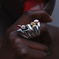 Model wearing Cocoerow Bella Ring in sterling silver with diamonds, emerald, amethyst, and sapphires