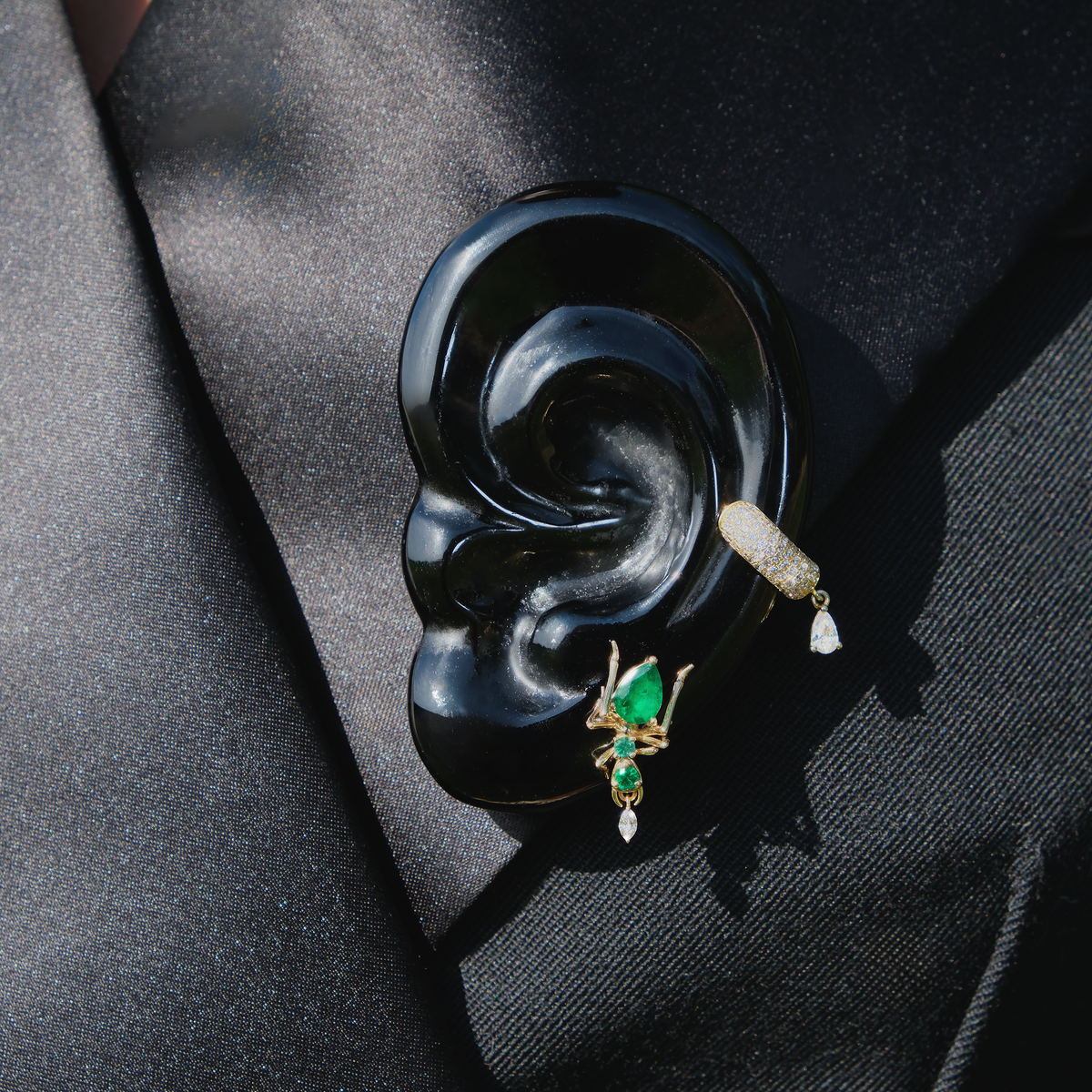 Cocoerow Black Obsidian Ear Brooch Okuta Collection Sculptural Fine Jewelry Lifestyle On Jacket