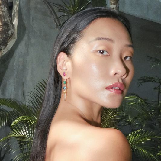 cocoerow fine jewelry vira pin earring on model in tulum 14k yellow gold jewelry